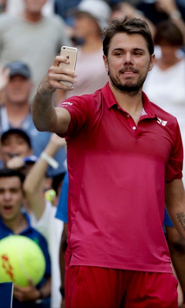 The Latest: Wawrinka advances in straight sets at US Open